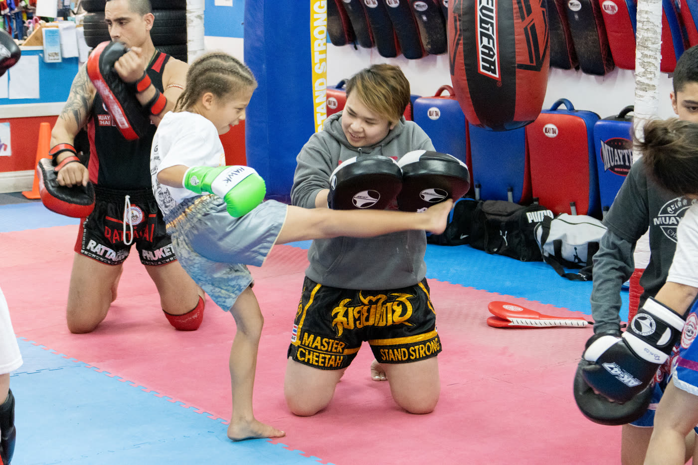 Young students trading knees